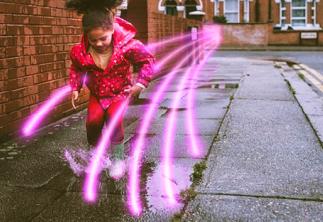 Girl running in rain with glowlines